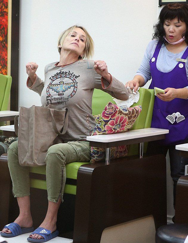 Sharon Stone warmed up in a nail salon