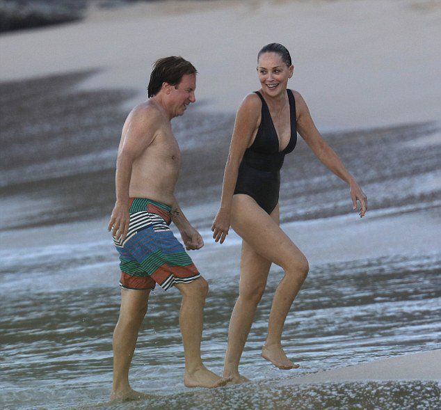 Stone with boyfriend Lonnie Cooper on the beach in St. Barts